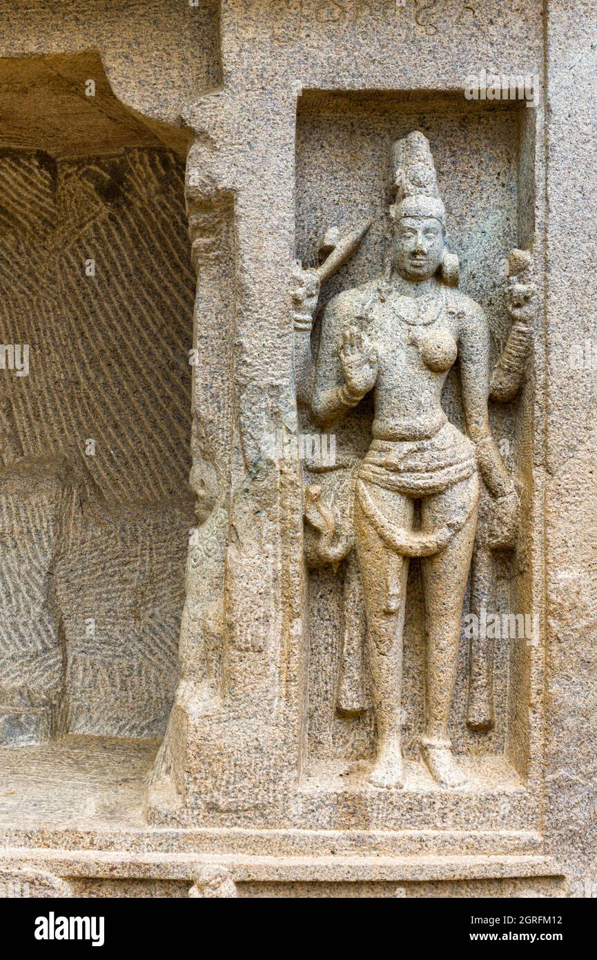 Rock art in base relief depicting symbols of ying-yang Hindu philosoply depicted in human form in Mamallapuram, Tamil Nadu, India. Stock Photo