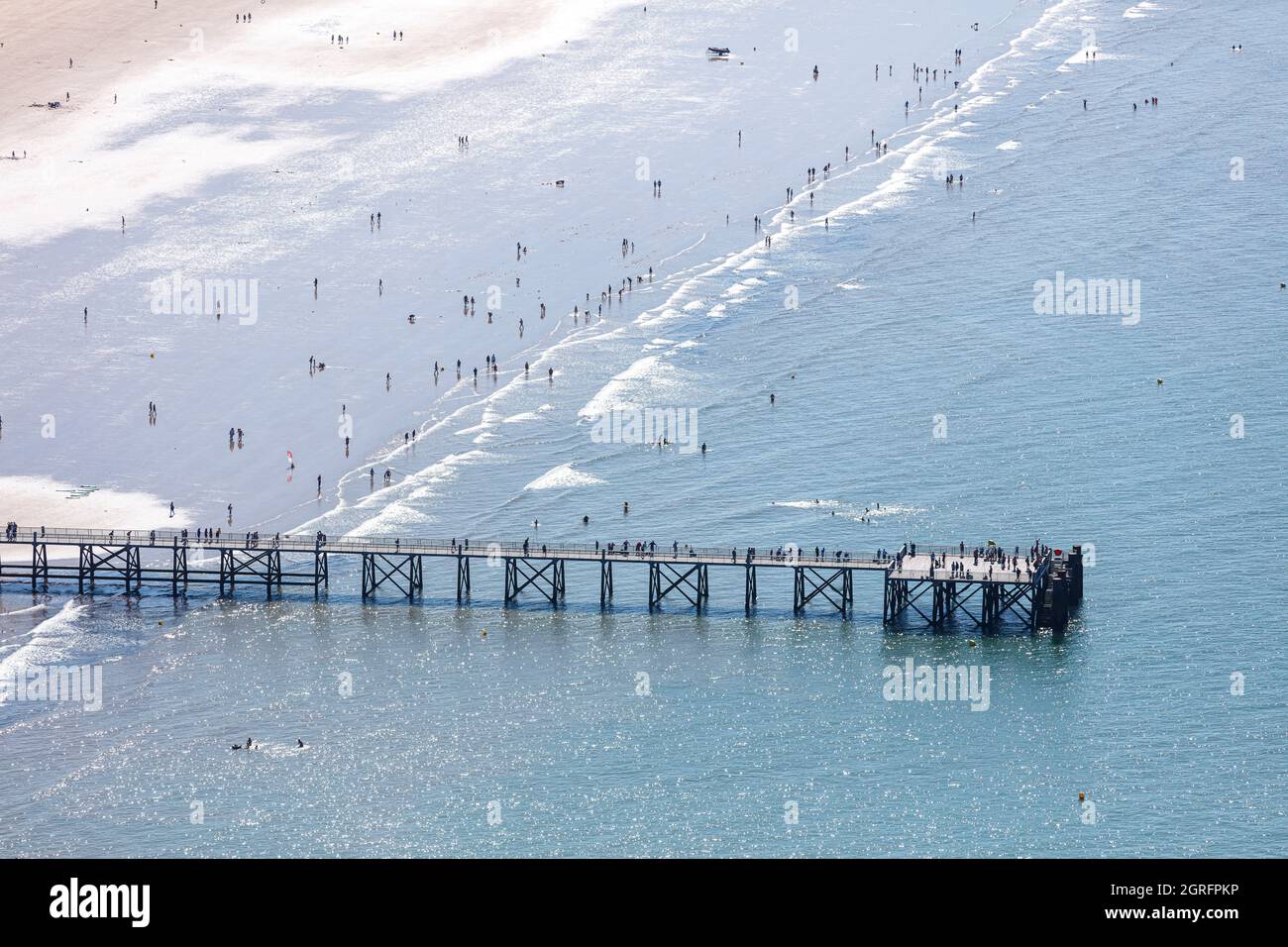 France, Vendee, St Jean de Monts, walkers and bathers on the beach and the jetty (aerial view) Stock Photo