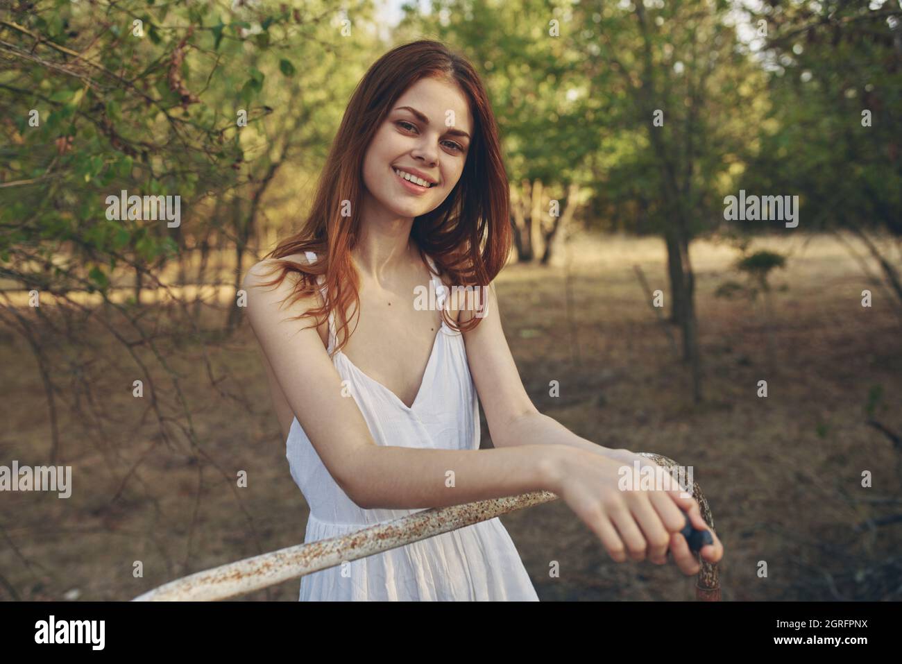 woman in white dress in field trees nature stroll Stock Photo - Alamy