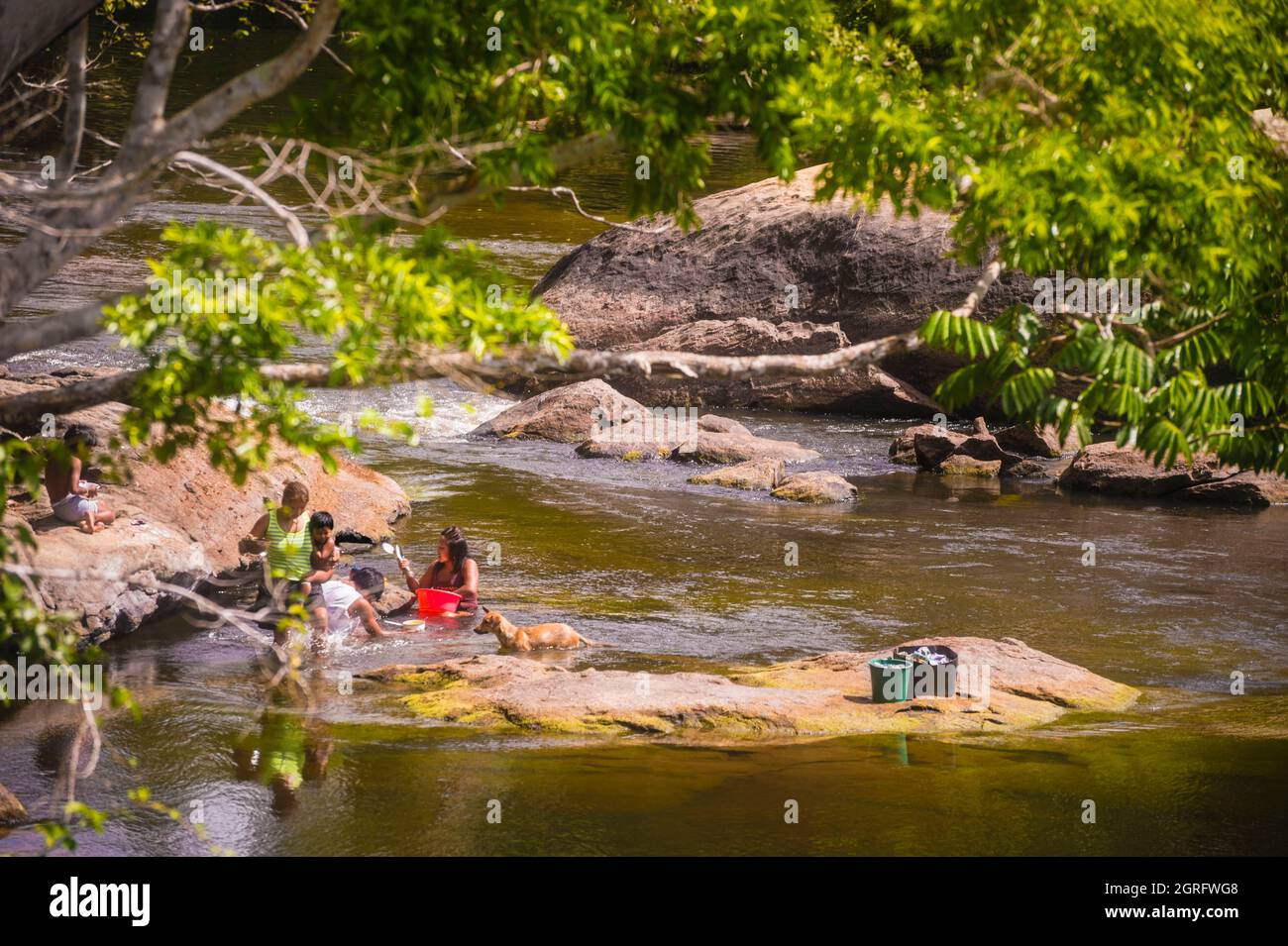 France, French Guiana, Camopi, Parc Amazonien de Guyane, heart zone, scene of life and laundry for an Amerindian family, in the Oyapock river (natural border with Brazil) Stock Photo