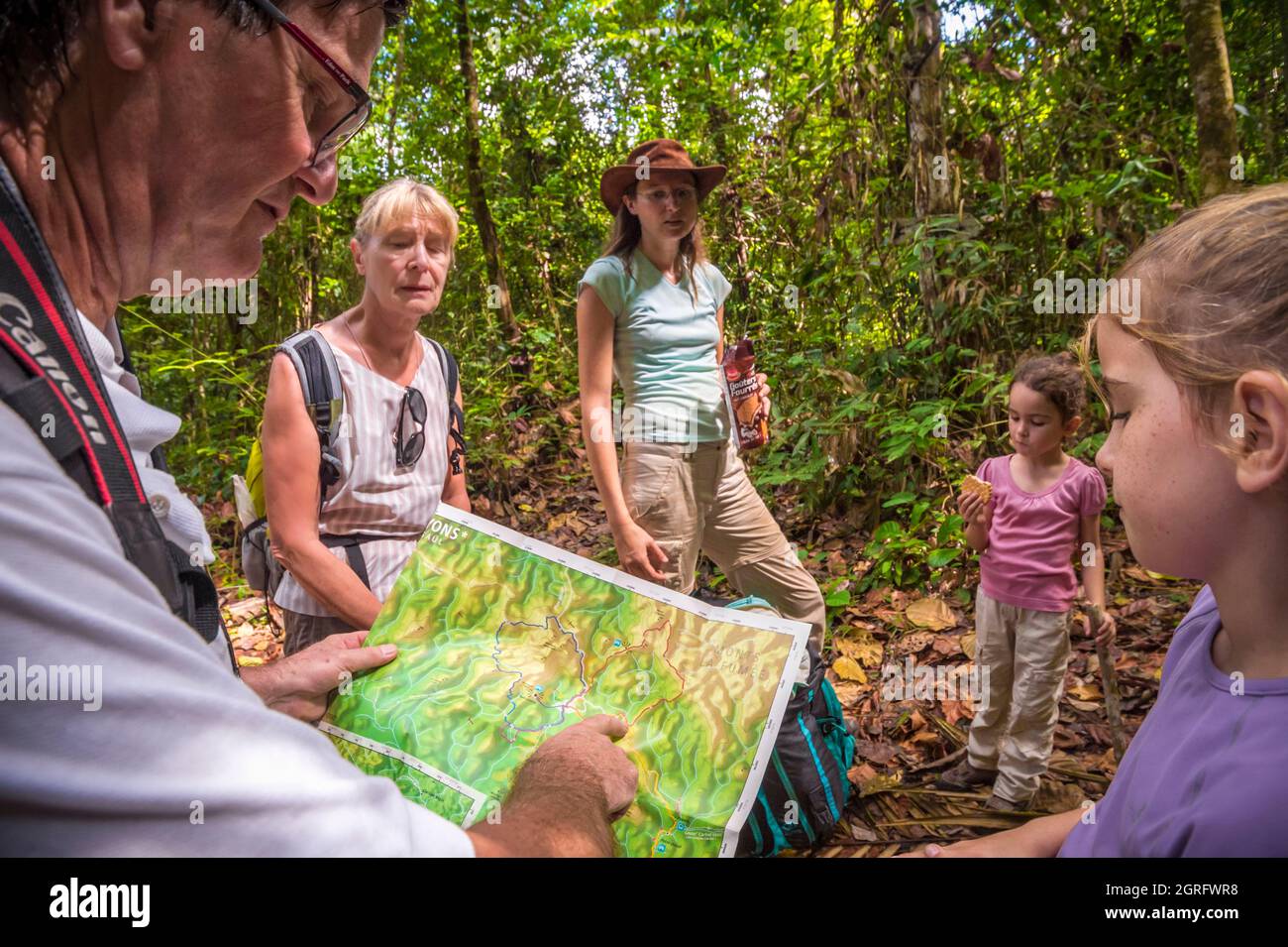 France, Guyana, Saül, French Guiana Amazonian Park, family of hikers on the Roche Bateau trail Stock Photo