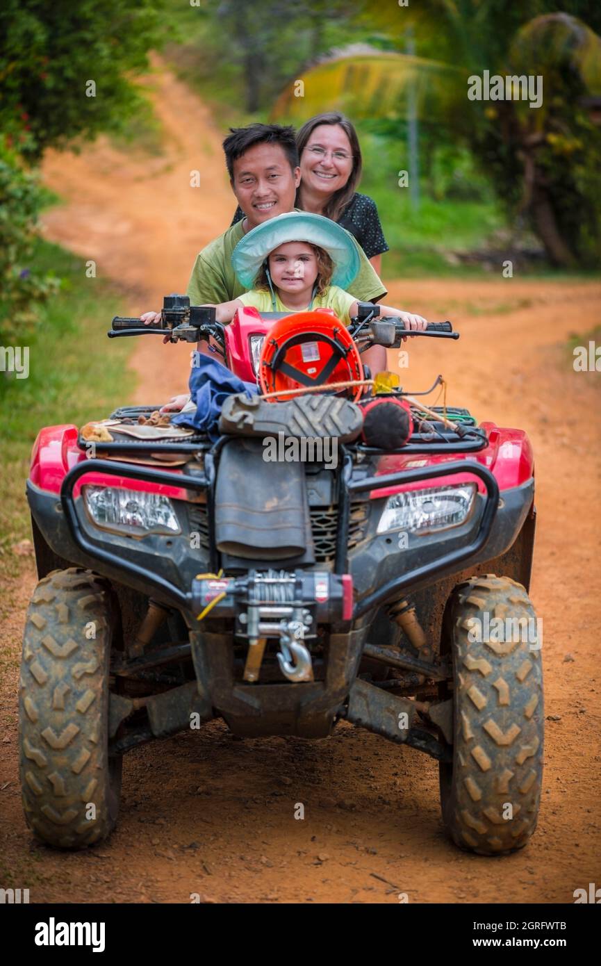France, French Guiana, Saül, Parc Amazonien de Guyane, family on a quad, unique means of transport used for work in the forest Stock Photo