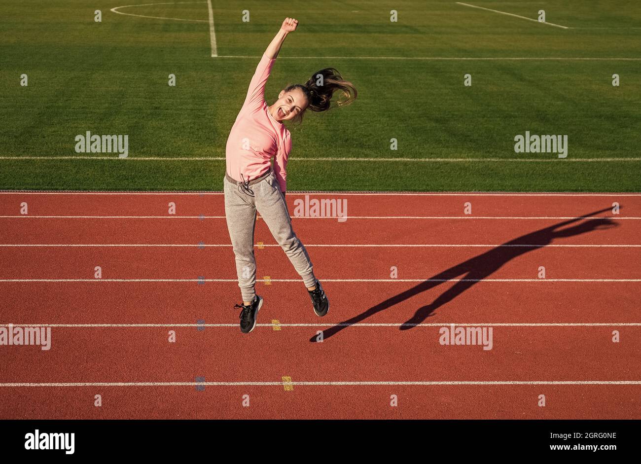 happy winner. runner on competition celebrate success. sprinter won on stadium gym. winner. child at school physical education lesson. pure happiness Stock Photo