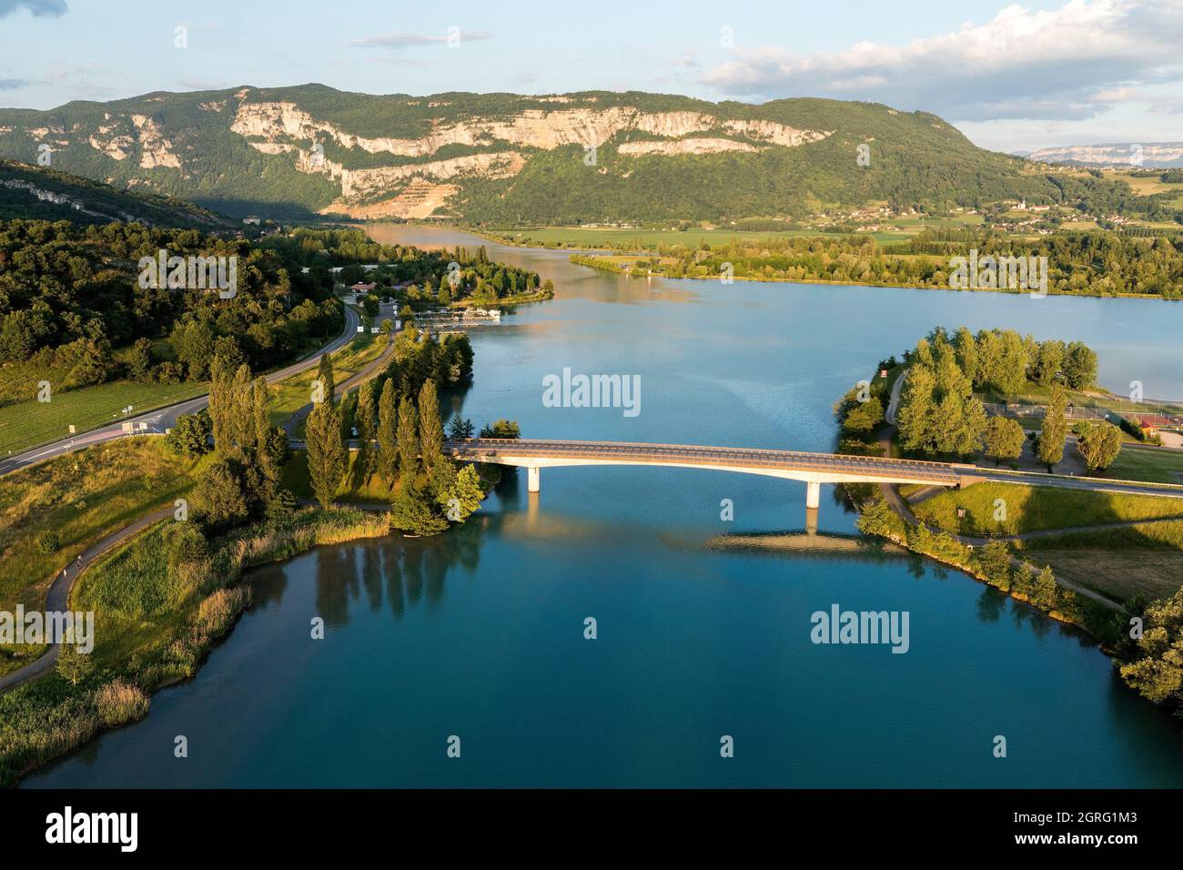 France, Ain, Murs et Gelignieux, road bridge and Cuchet lake on the Rhone river, Mont Tournier in the background (aerial view) Stock Photo