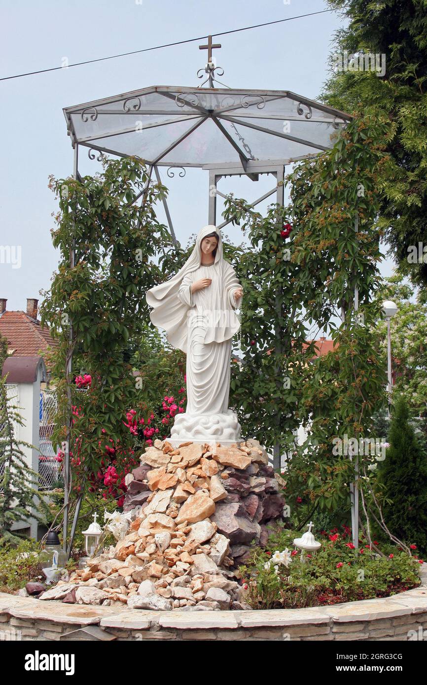 Our Lady of Medjugorje, statue in front of the church of St. Anthony of Padua in Bjelovar, Croatia Stock Photo