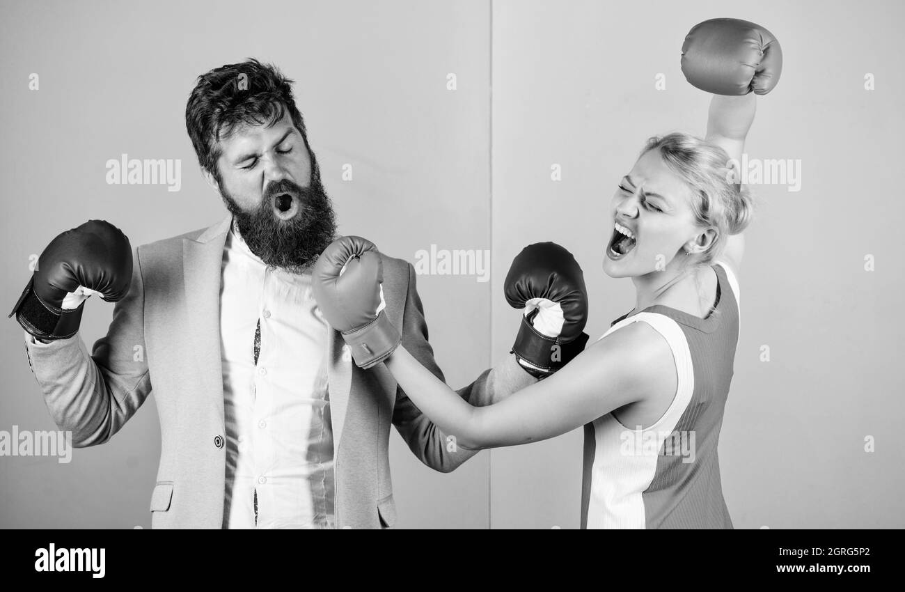 Man and woman boxing fight. Couple in love competing in boxing