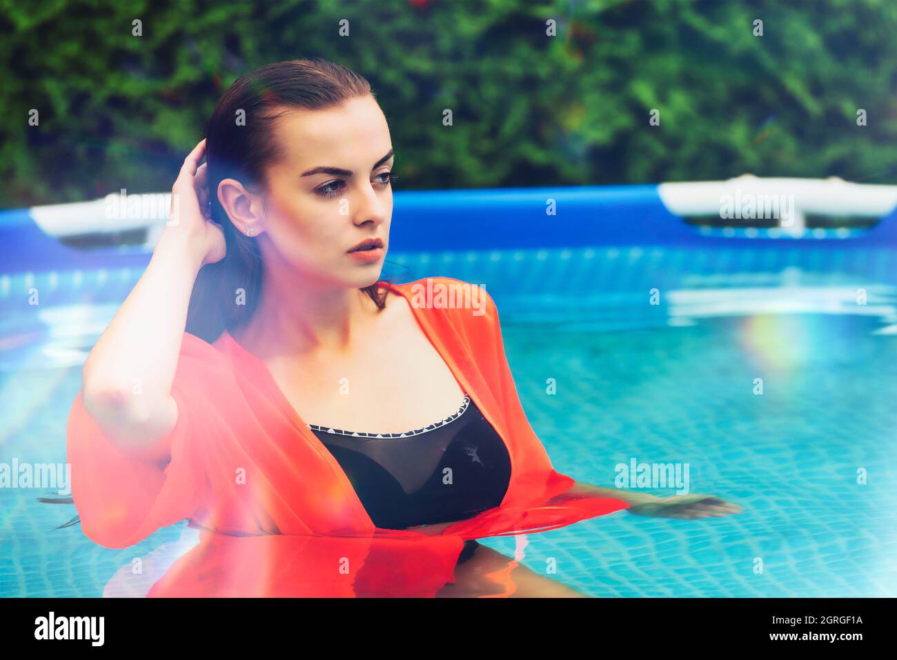 Portrait of a beautiful woman in the swimming pool Stock Photo - Alamy