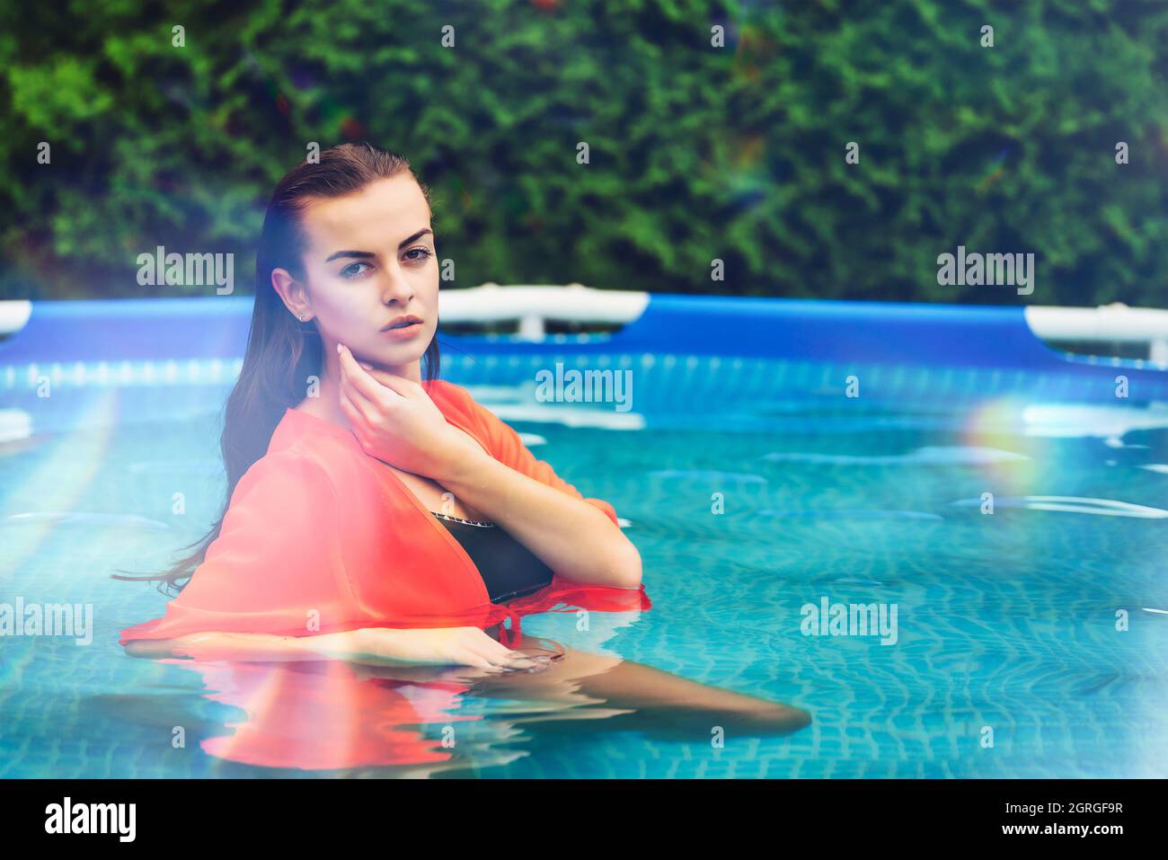 Portrait of a beautiful woman in the swimming pool Stock Photo - Alamy