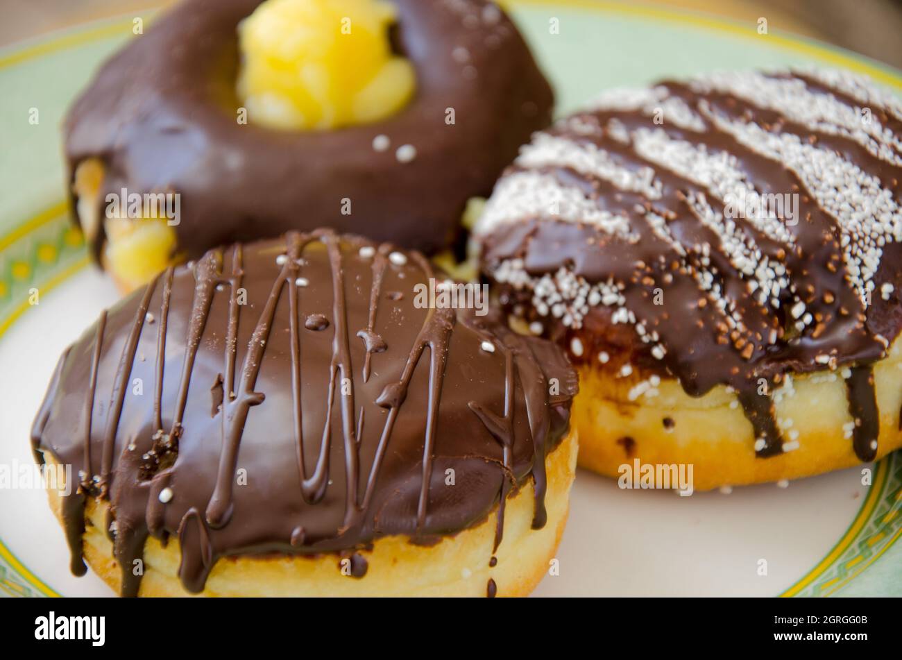 Three Chocolate Donuts Stock Photo