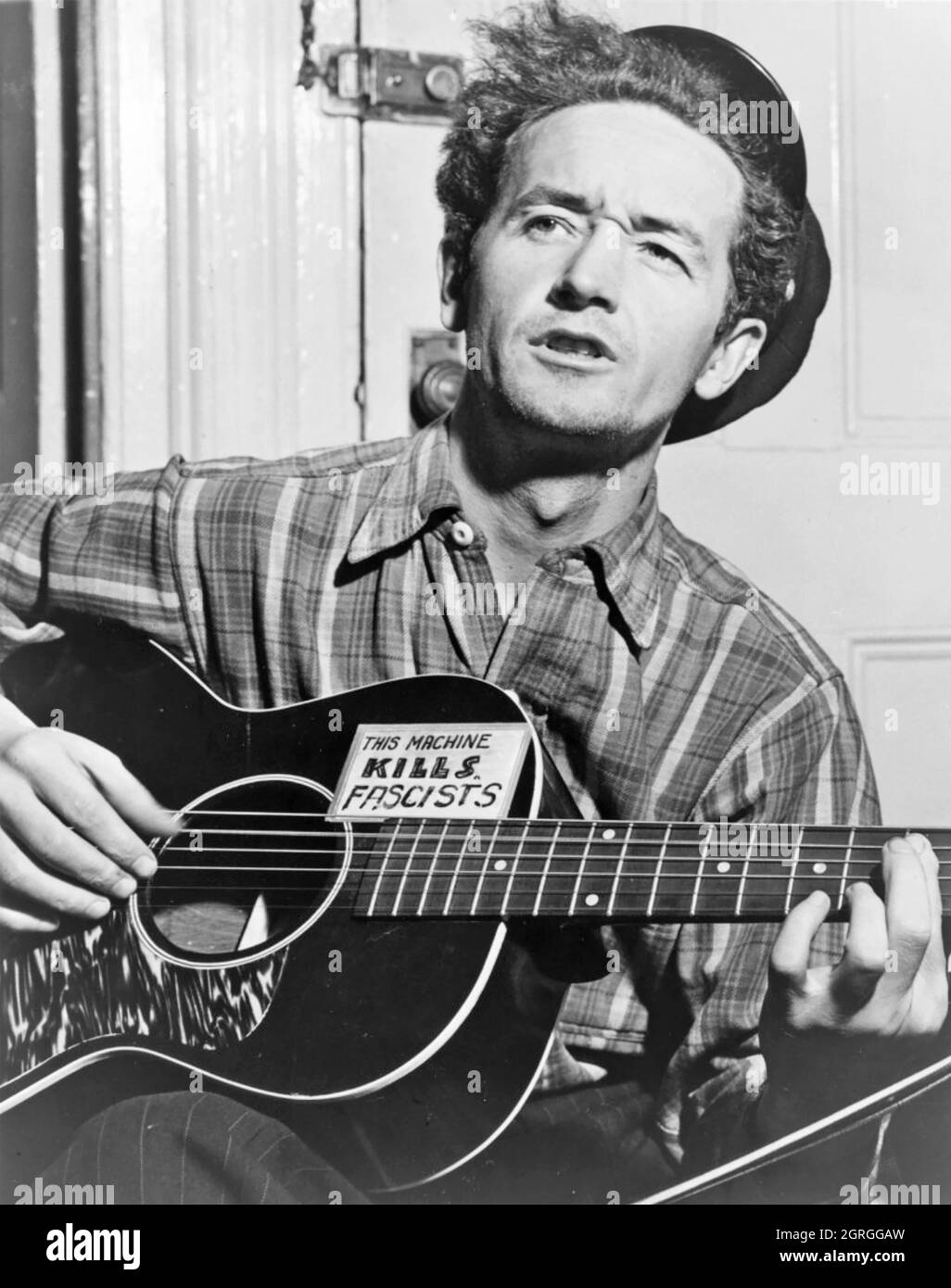 WOODY GUTHRIE (1912-1967) Promotional photo of American folk musician in March 1943 Stock Photo