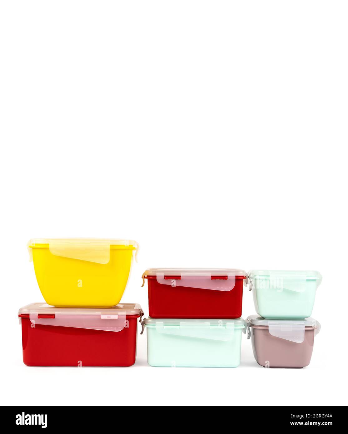 A set of multi-colored plastic containers for storing food and having a ...