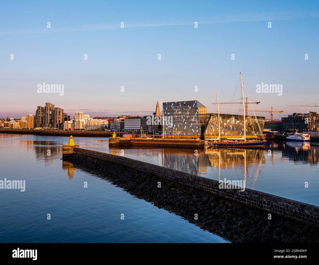 Reykjavik harbor and city center at sunset. Stock Photo
