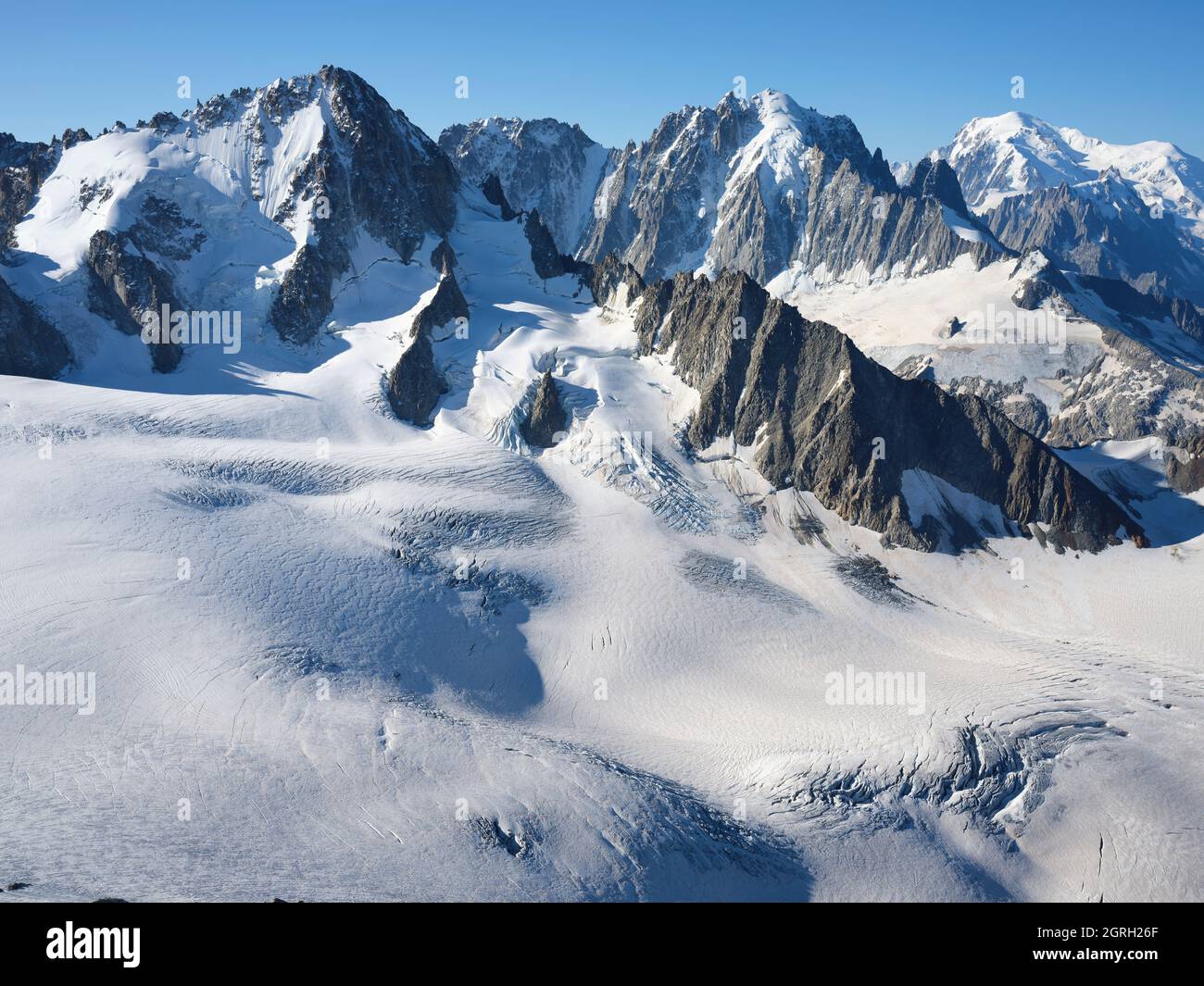 AERIAL VIEW. Left to right; Aiguille du Chardonnet (3824m), Aiguille Verte (4122m), Mont Blanc (4807m). Chamonix, Haute-Savoie, France. Stock Photo