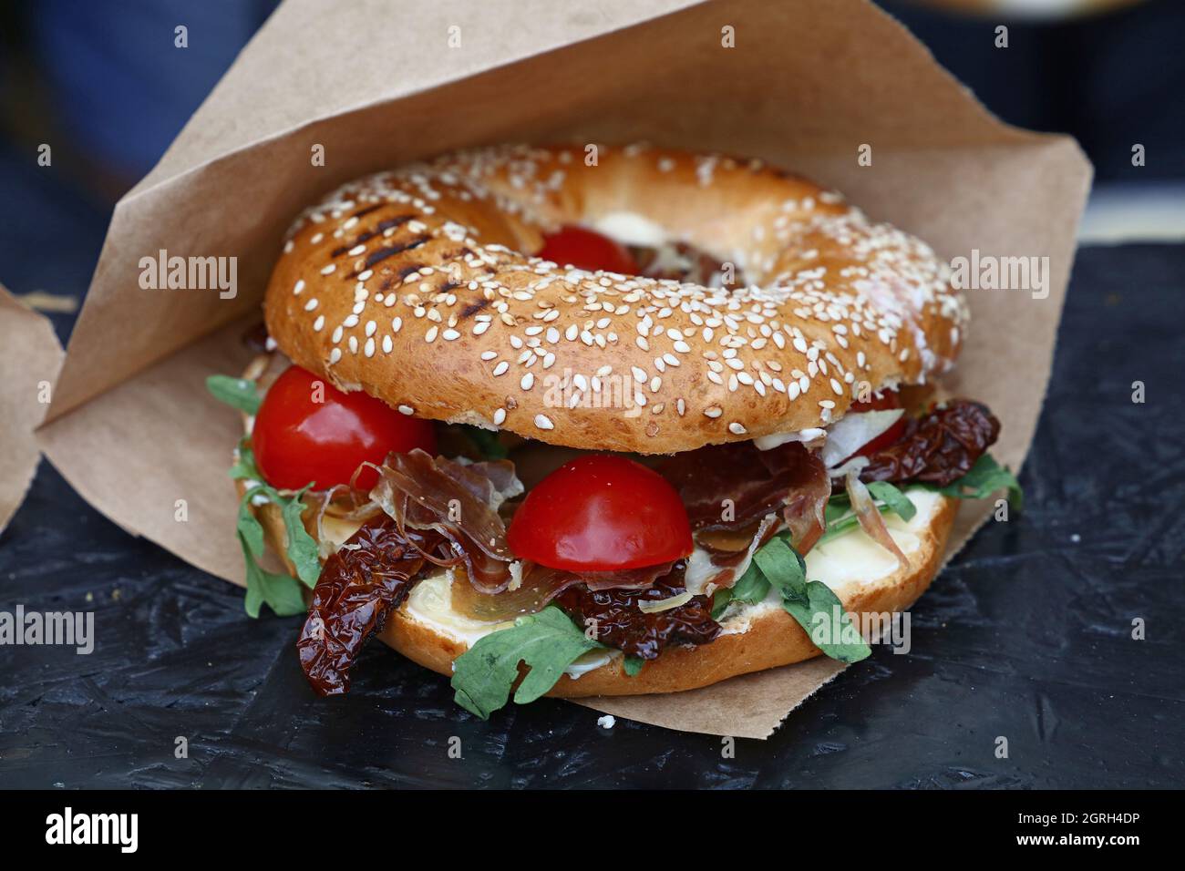 Close-up Of Burger In Paper Bag On Table Stock Photo