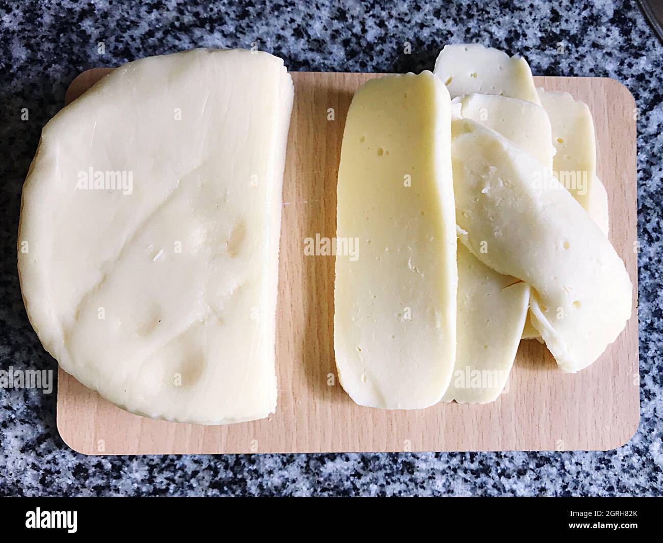 High Angle View Of Soft Cheese On Cutting Board Stock Photo