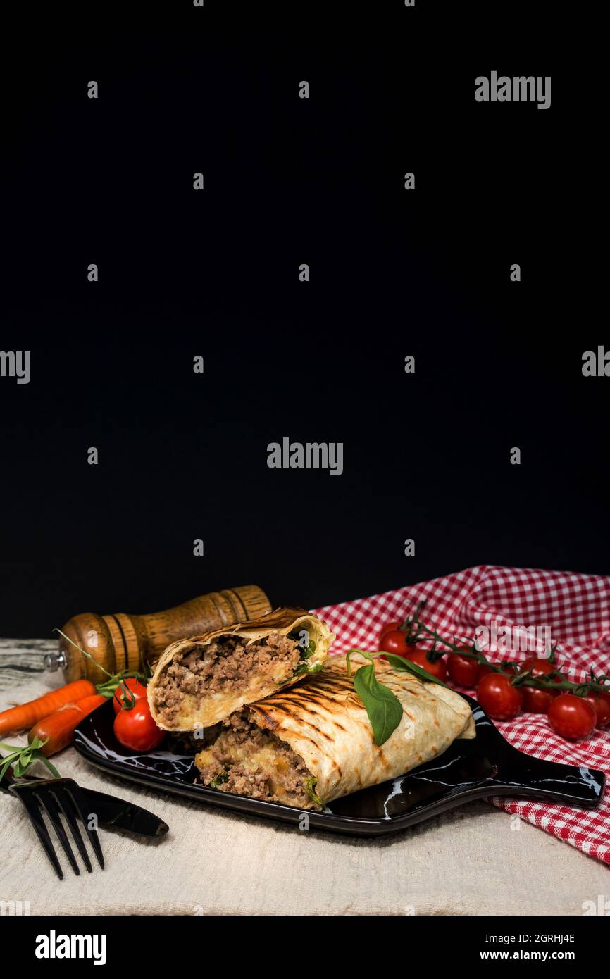 High Angle View Of Wrap Sandwich In Tray On Table Stock Photo