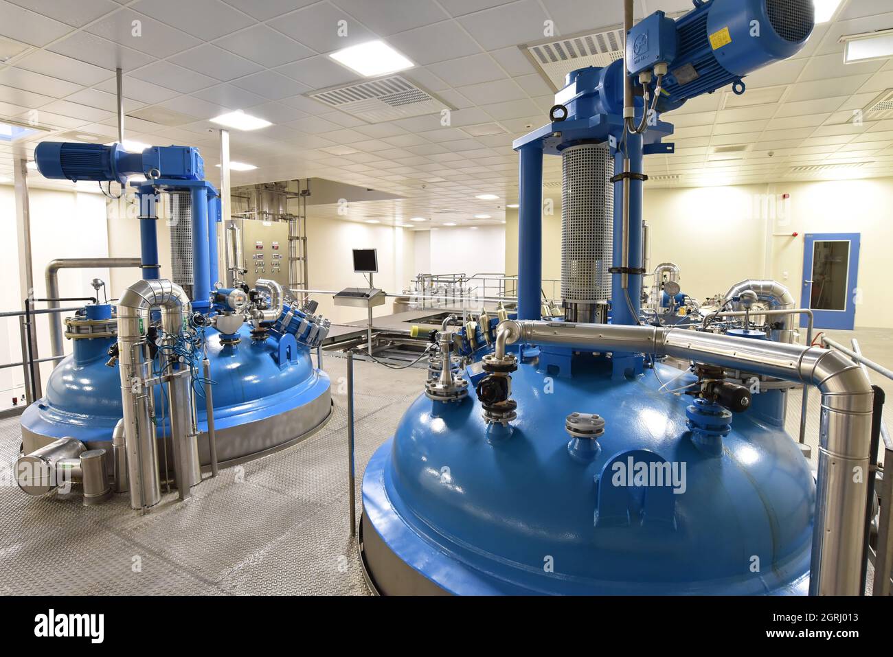 Interior of an industrial plant - pipelines, tank for storage Stock Photo