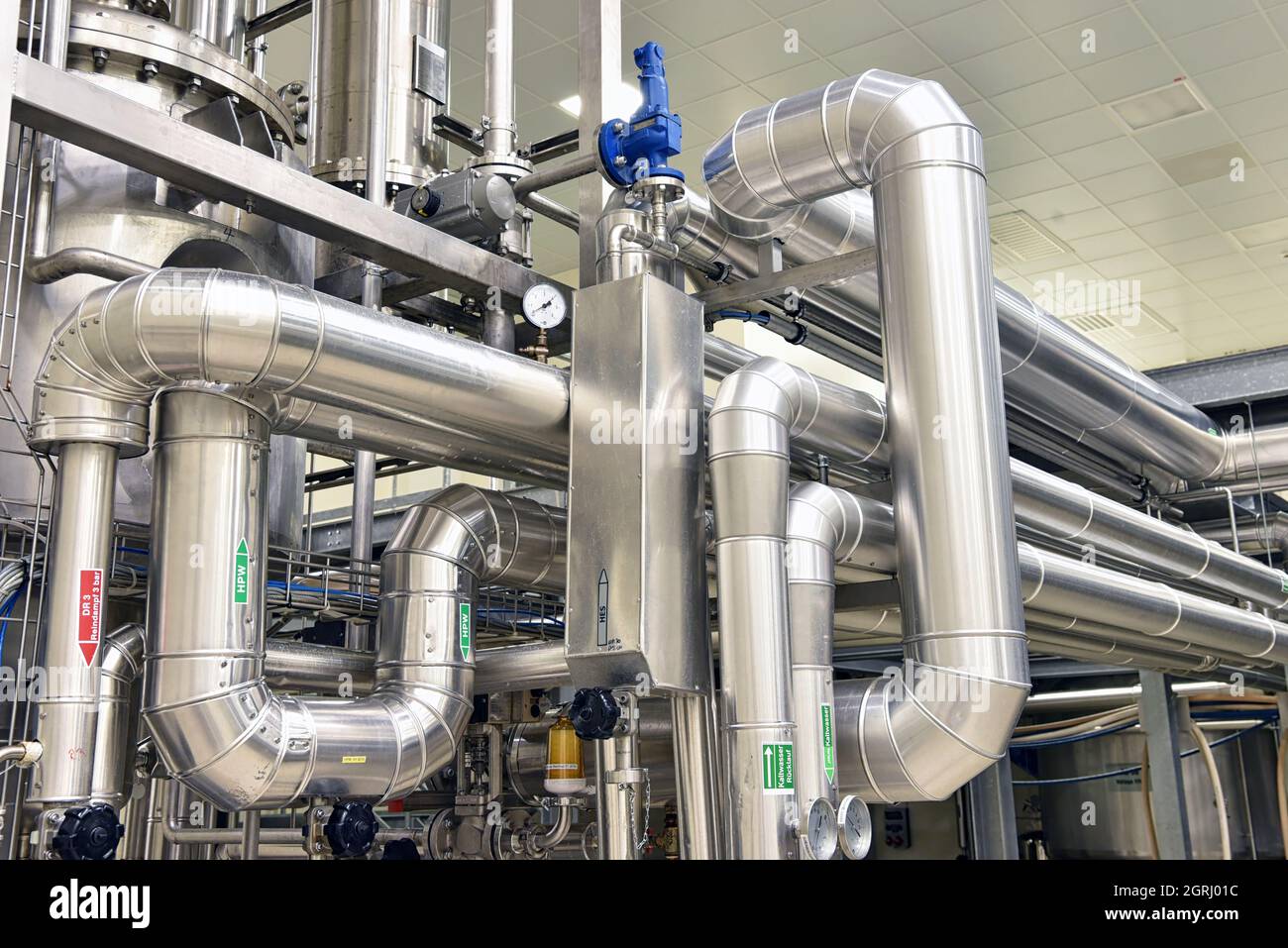 Interior of an industrial plant - pipelines, tank for storage Stock Photo