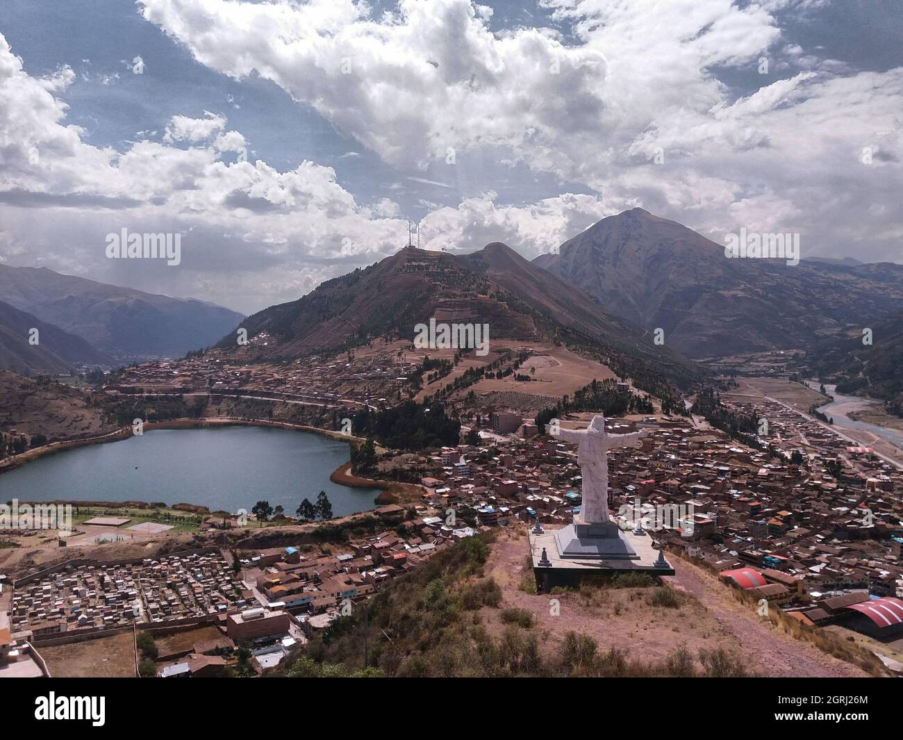 Aerial view of Cristo Blanco statue on a hill under the cloudy sky