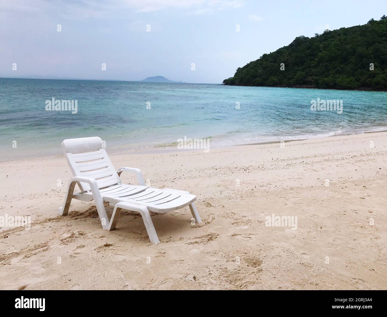 Chairs On Beach Against Sky Stock Photo