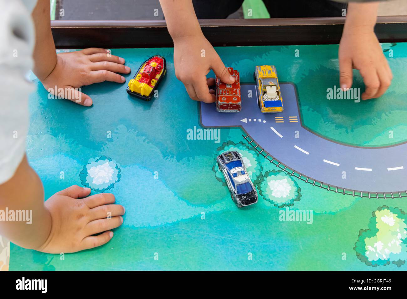 A view of children hands, playing an imaginative play, by making a