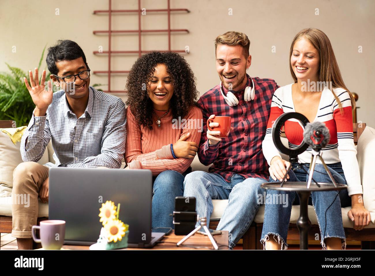 Young friends group sharing info on streaming platform with webcam -  Community concept with multicultural and multiethnic friends having fun  vlogging Stock Photo - Alamy