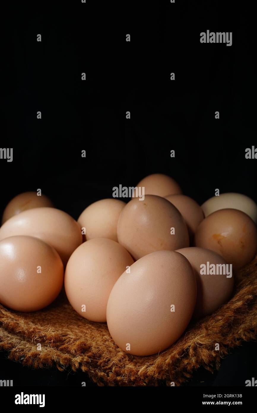 Close-up Of Eggs Against Black Background Stock Photo
