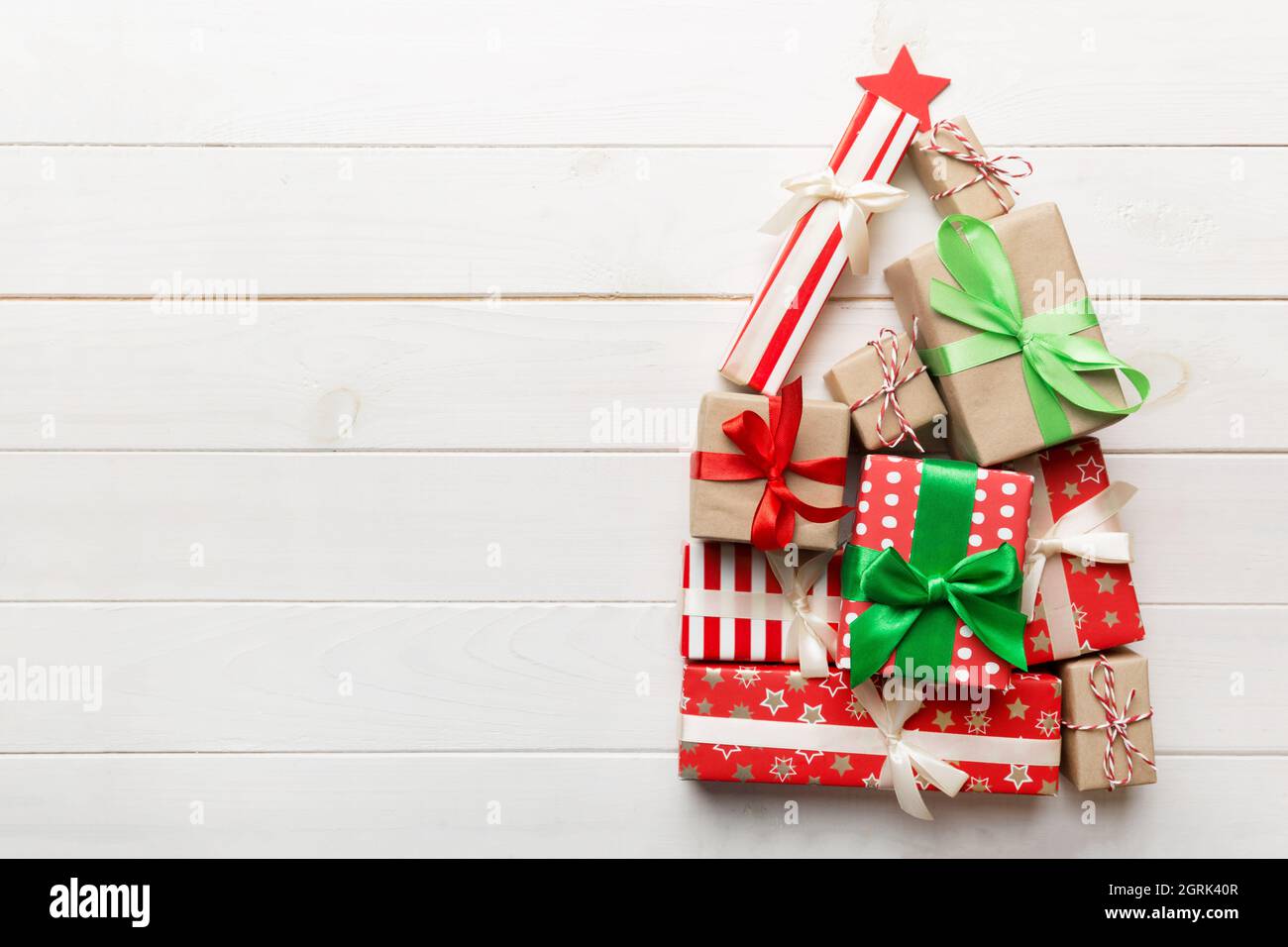 Christmas tree made of beautifuly wrapped presents on colored