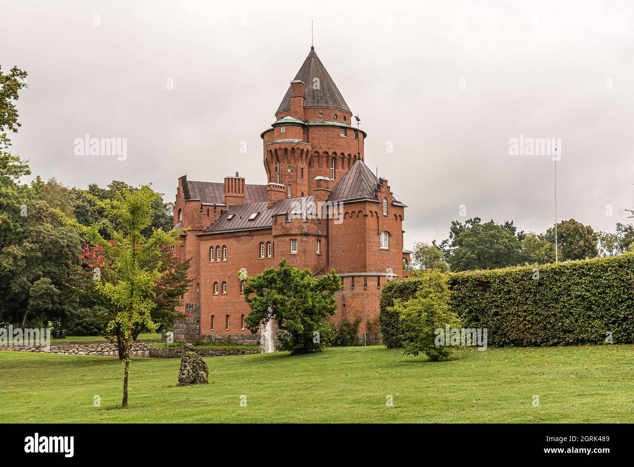 the romantic Hjularod fairy tale castle in a green lawn with a tall tower, Eslov, Sweden, September 16, 2021 Stock Photo