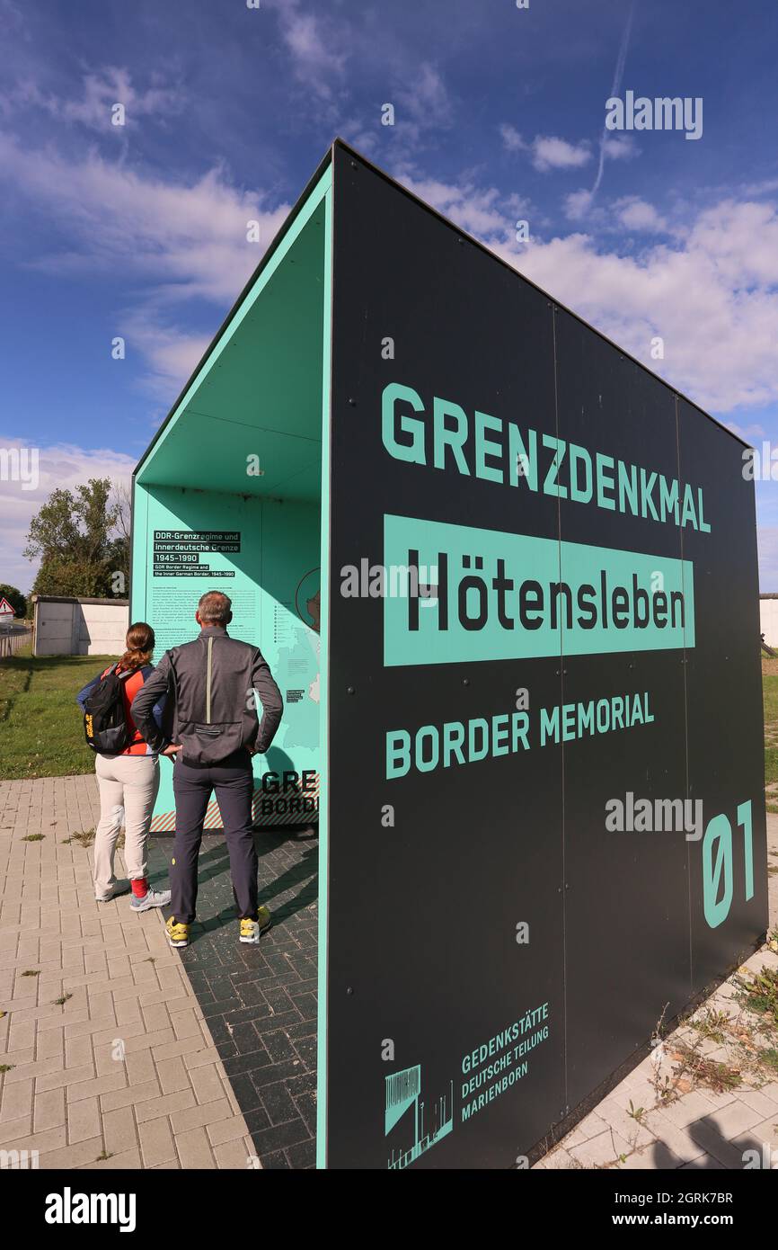 01 October 2021, Saxony-Anhalt, Hötensleben: Visitors learn about an original preserved border barrier. Unity ambassadors from all federal states planted 16 oak trees today in the presence of Saxony-Anhalt's Prime Minister Haseloff. Photo: Matthias Bein/dpa-Zentralbild/ZB Stock Photo