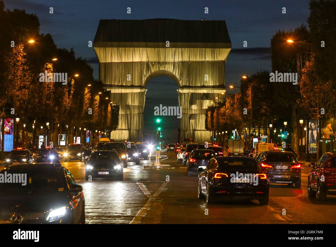 ARC DE TRIOMPHE WRAPPED SUNSET AND NIGHTIME, PARIS Stock Photo