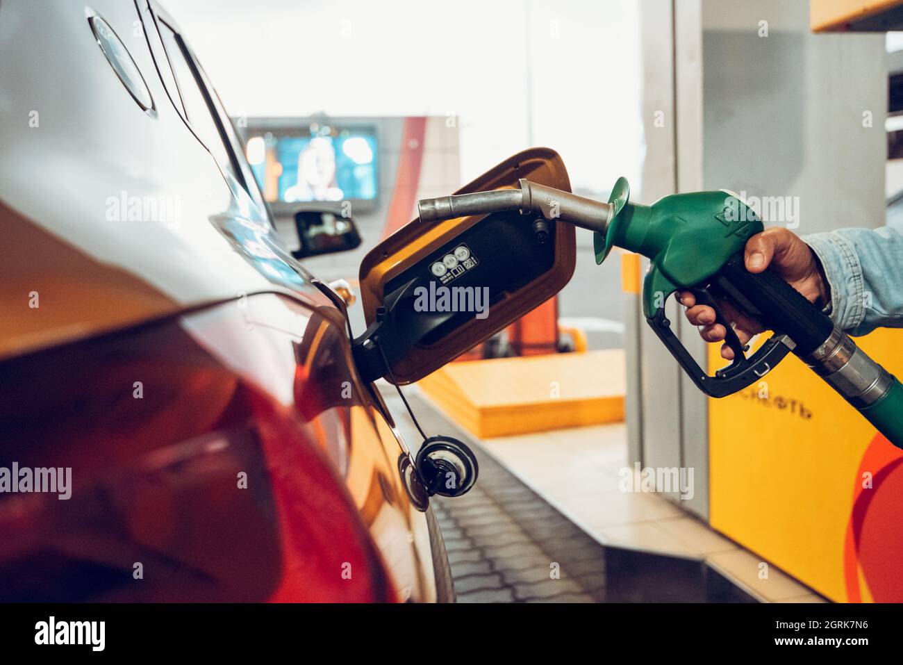 Car refueling fuel on petrol station. Automotive industry or