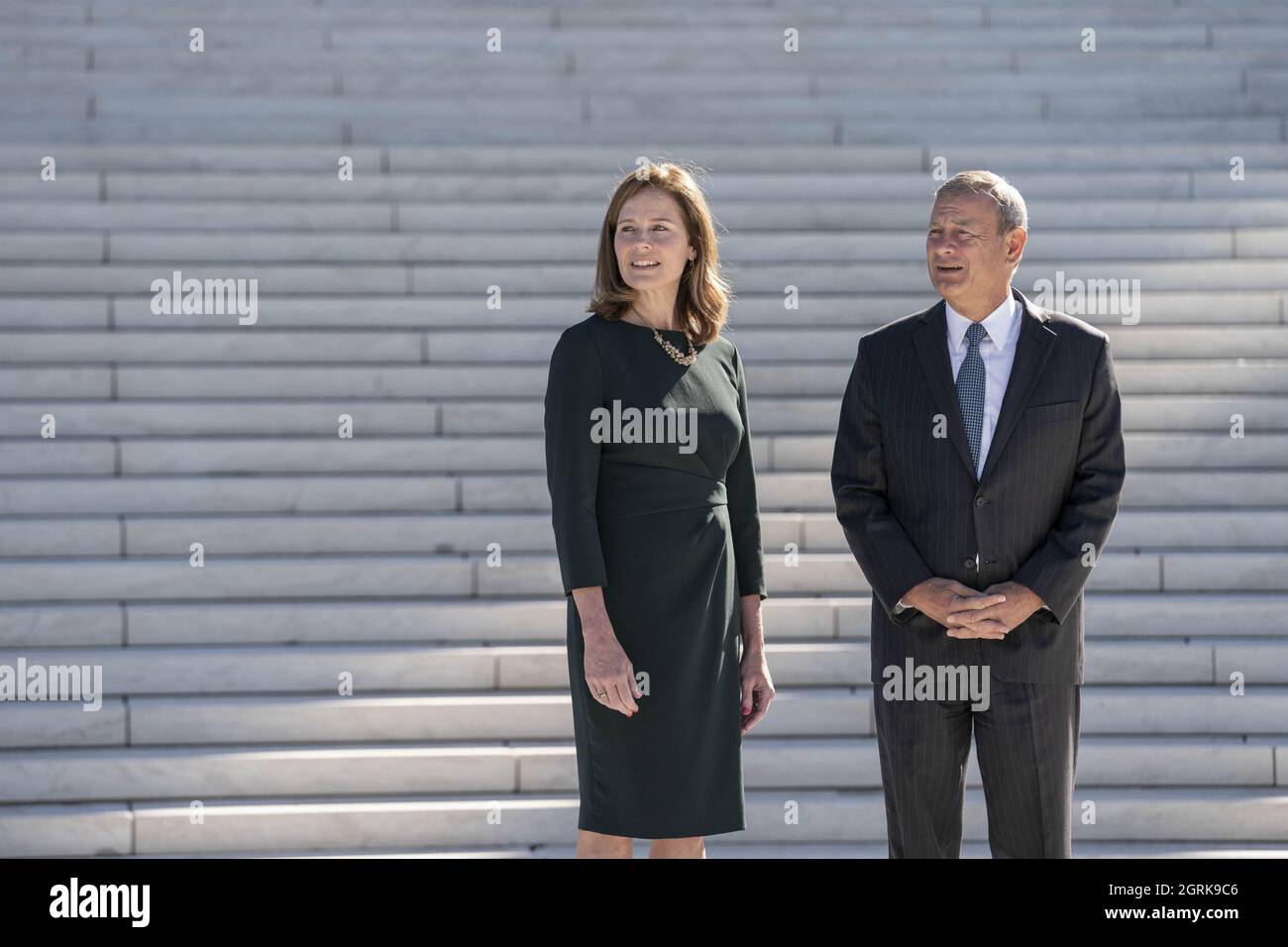 Washington, United States. 01st Oct, 2021. Supreme Court Justice Amy Coney Barrett and Chief Justice of the Supreme Court John Roberts participate in a photo-op outside of the Supreme Court of the United States following a investiture ceremony in Washington, DC on Friday October 1, 2021. Photo by Sarah Silbiger/UPI Credit: UPI/Alamy Live News Stock Photo
