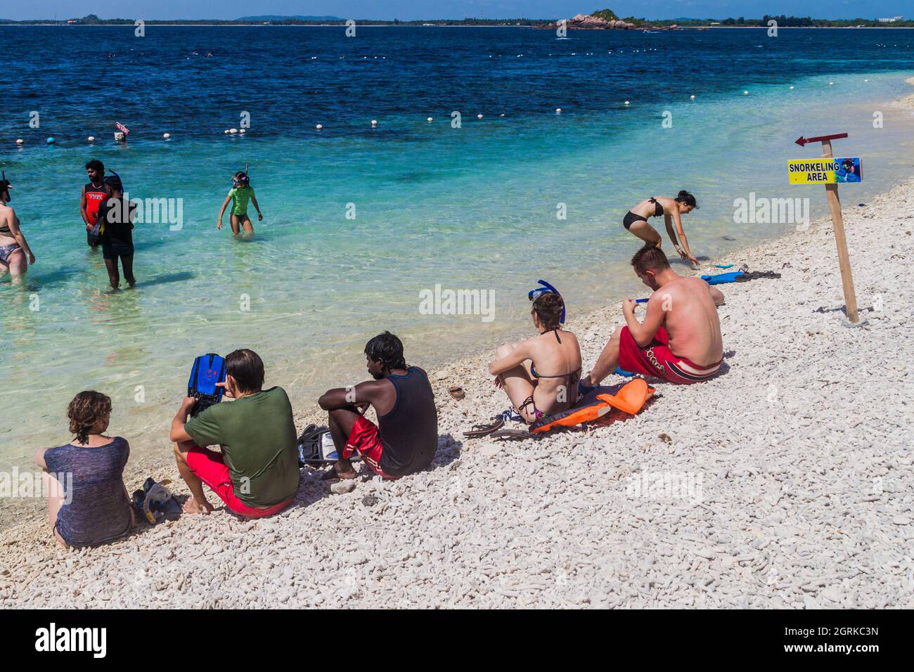 PIGEON ISLAND, SRI LANKA JULY 25, 2016 People snorkel on a coral