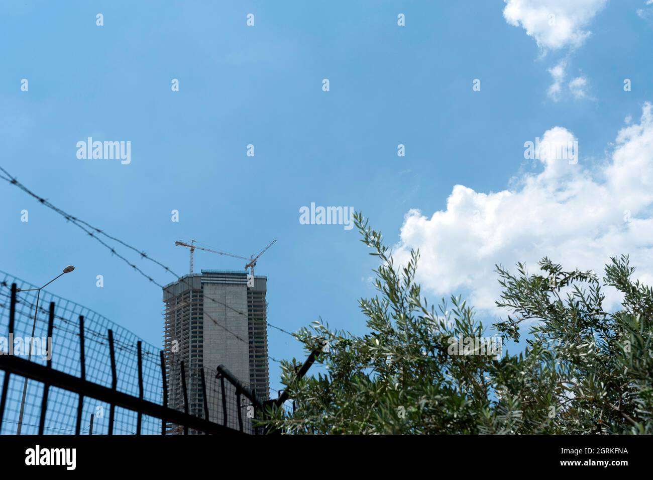 Tall building under construction in the city Stock Photo
