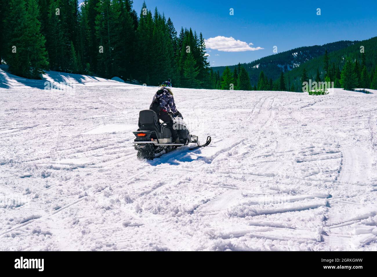 Person Riding Snow Mobile In Winter Landscape Fun Tour Stock Photo - Alamy