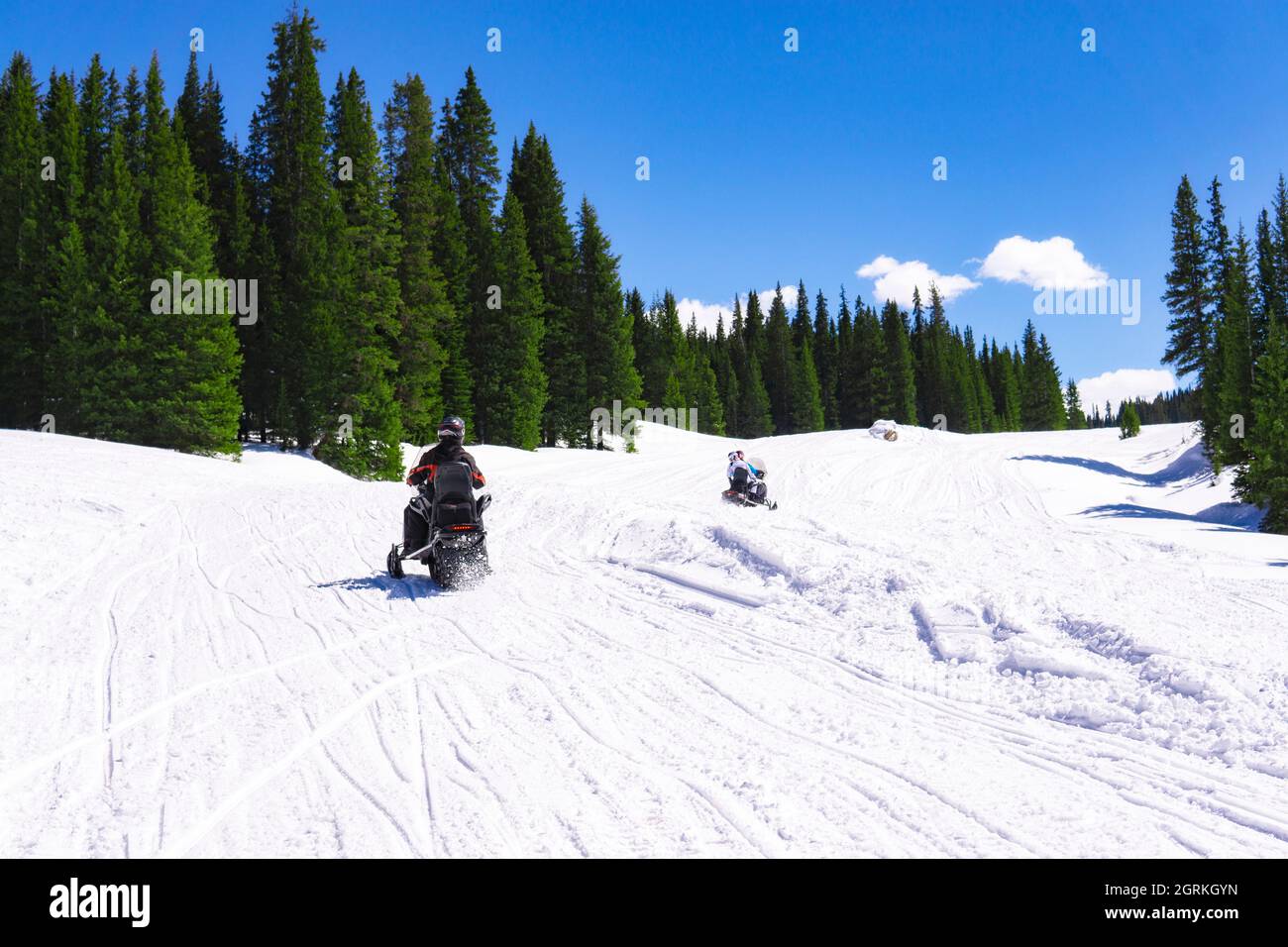 Snow Mobile Winter Recreation Concept In Snow Mountains Stock Photo