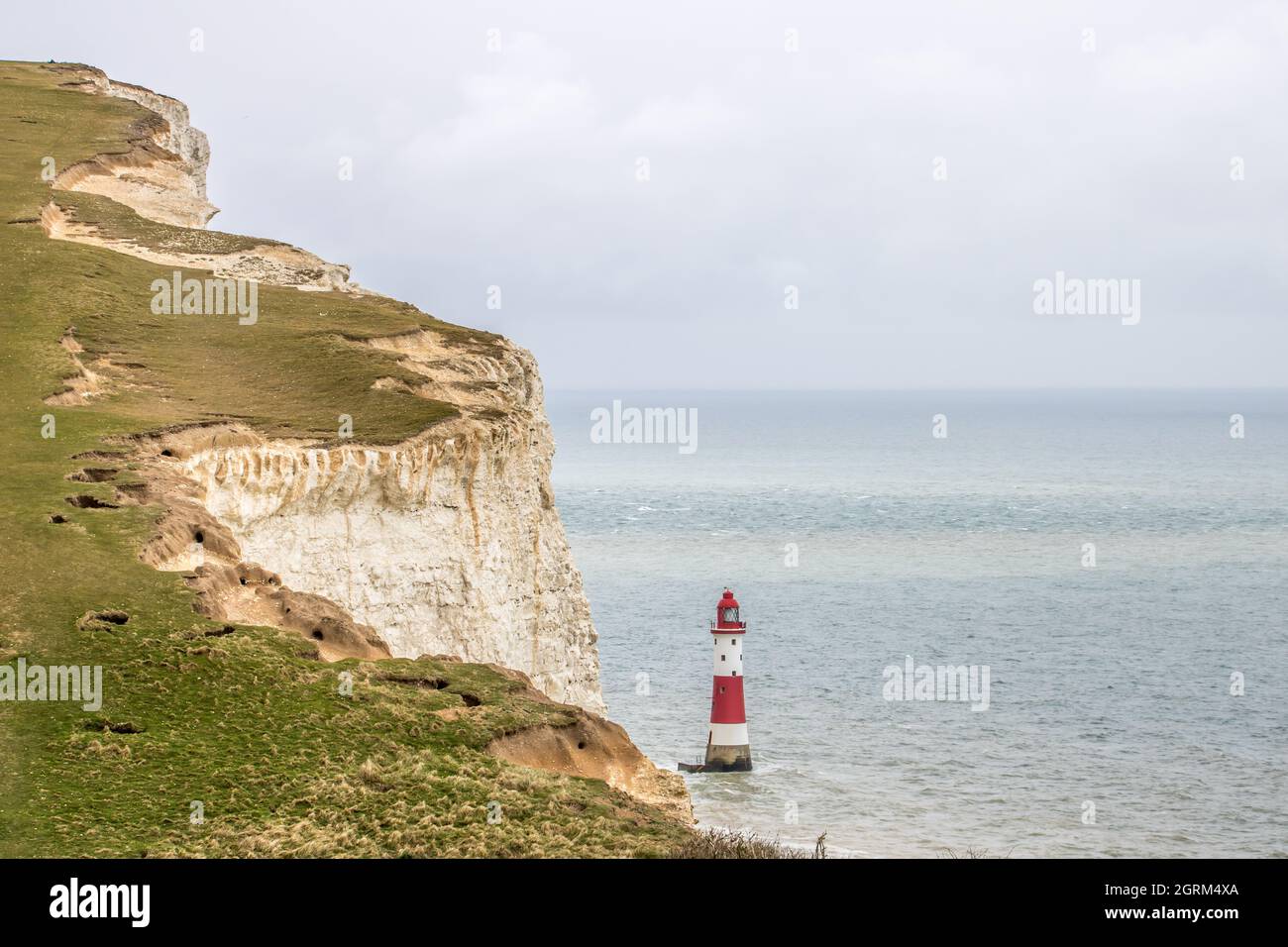 Beachy Head Lighthouse located in the English Channel below the cliffs at Beach Head in East Sussex Stock Photo