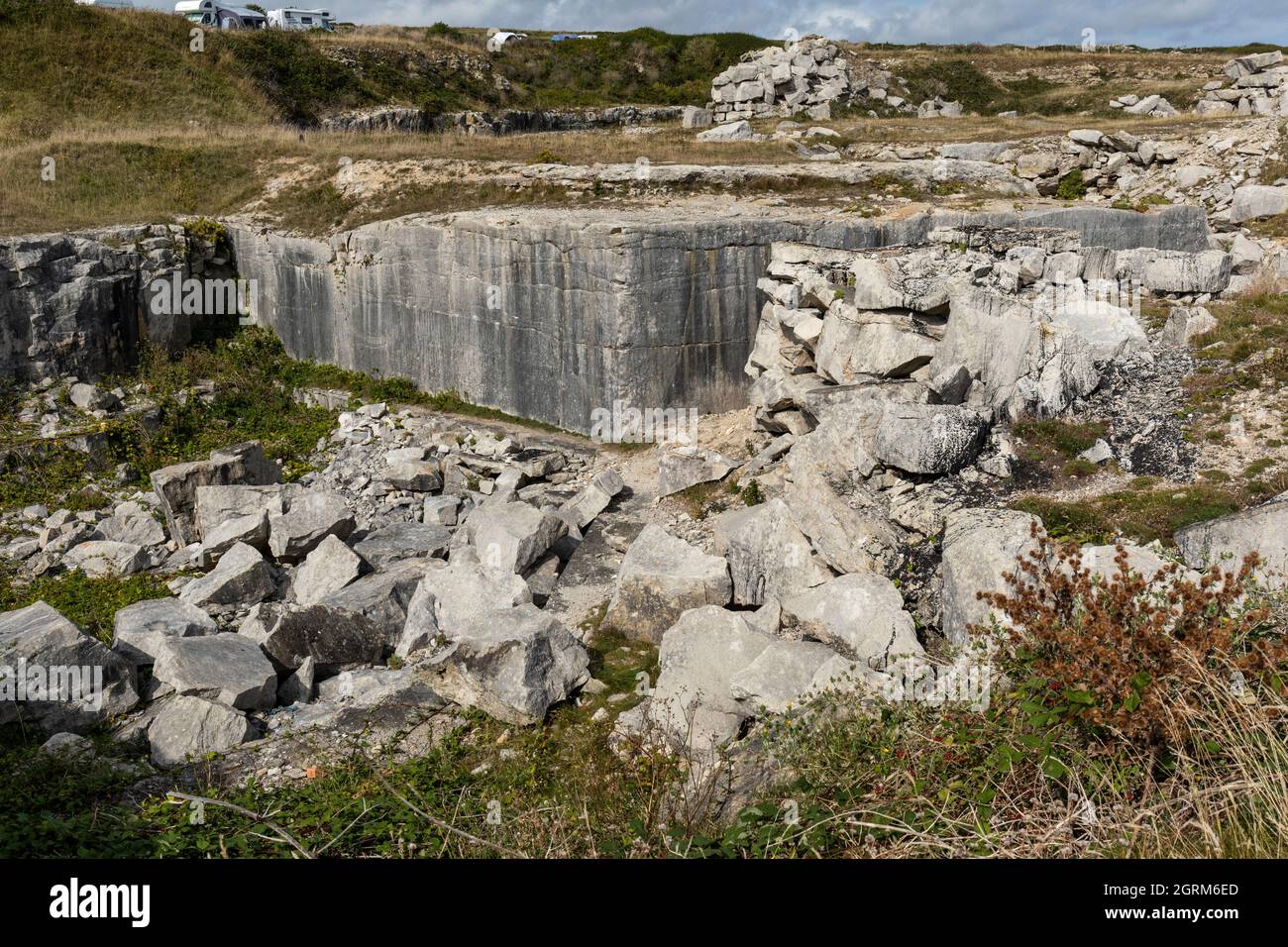 Old disused Portland stone quarry along the rocky quarried coastline at