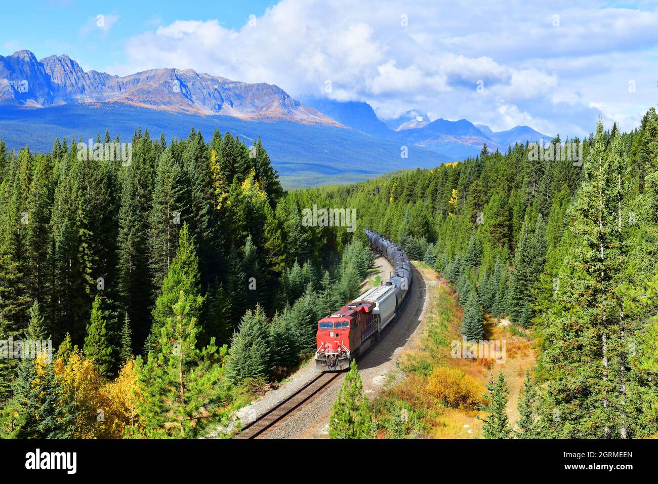 Long Freight Train Moving Along In Banff National Park, Canadian