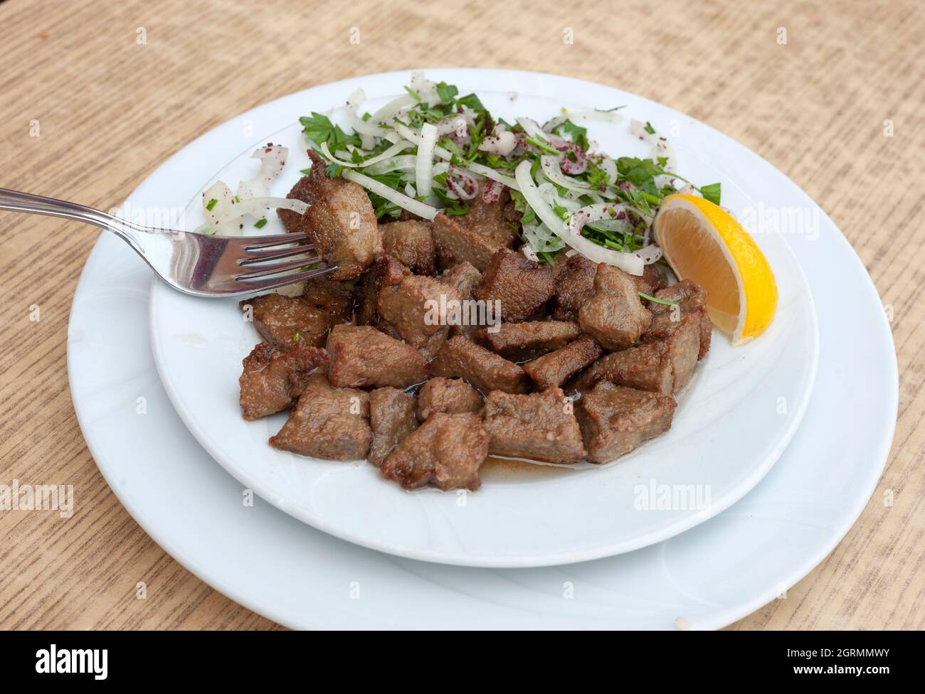 Albanian liver food, cayenne liver, liver, lung, kidney food, liver fries, Arnavut ciğeri, Turkish traditional fried liver. Stock Photo