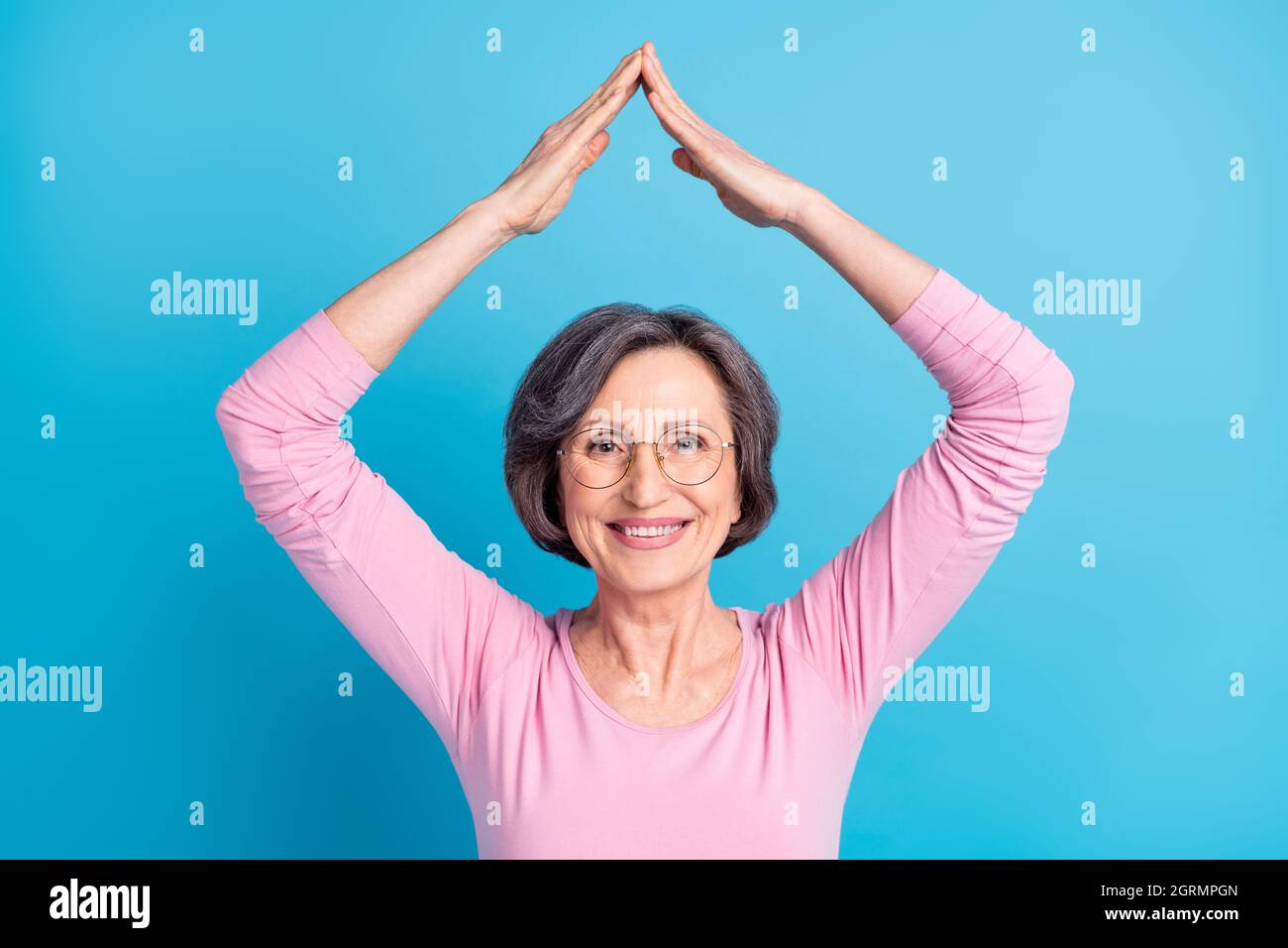 photo-of-happy-beautiful-pretty-sweet-mature-woman-hold-hands-roof