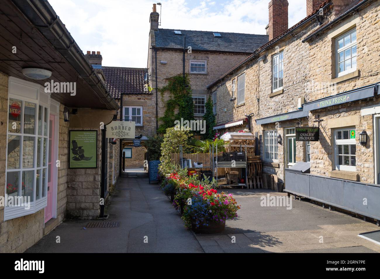 Shops up an Alleyway in Helmsley, North Yorkshire, Stock Photo