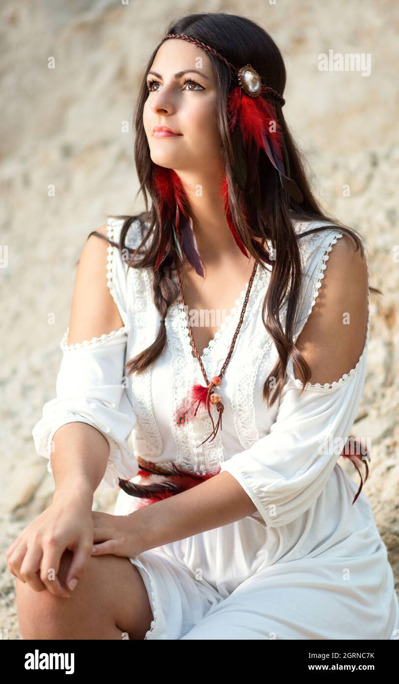 Young pretty woman as an Indian woman looks into the distance Stock Photo