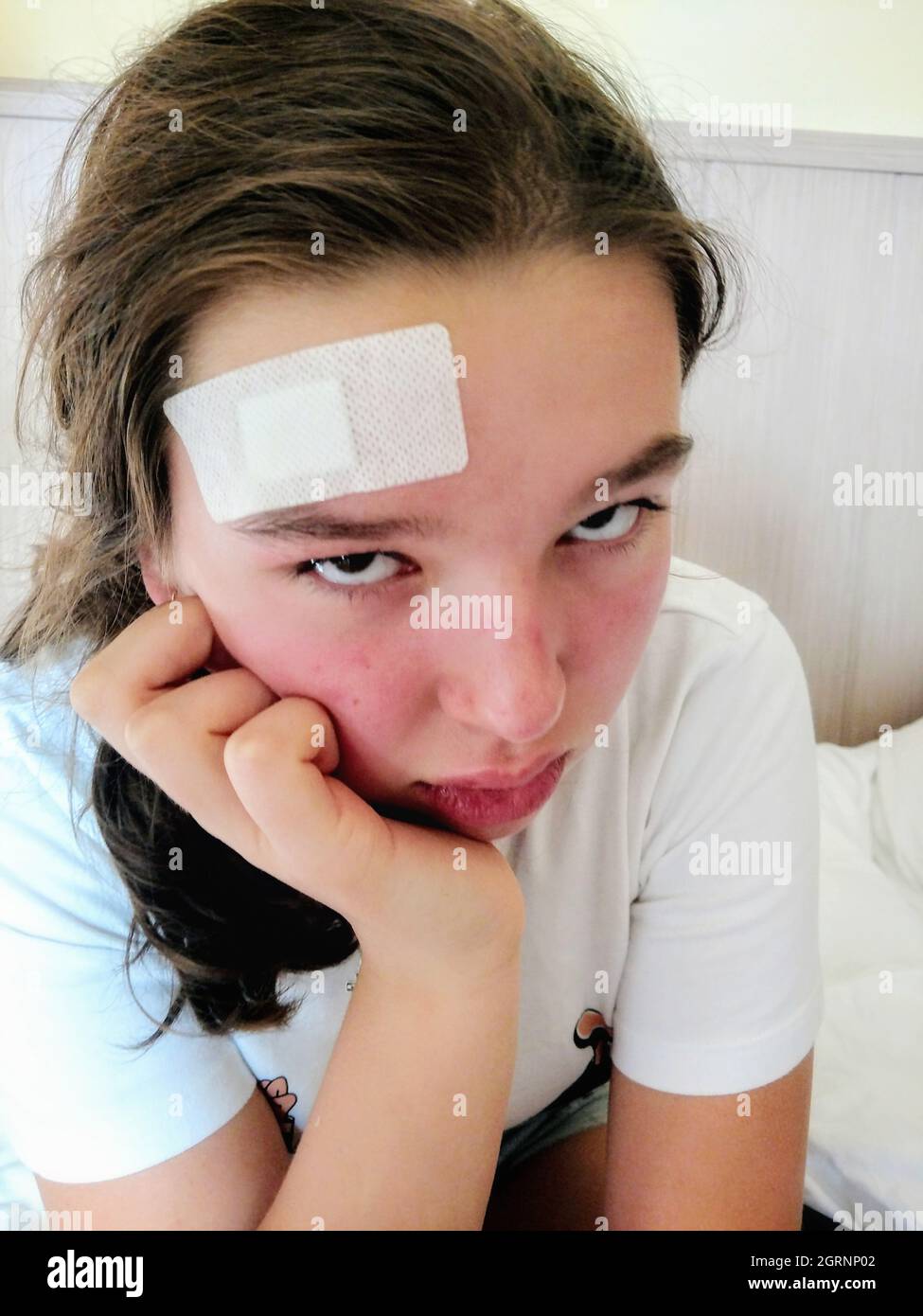 Close-up Portrait Of Girl With Bandage On Head Stock Photo