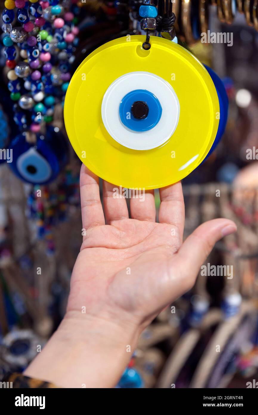 Big evil eye bead in female hand stock photo Stock Photo