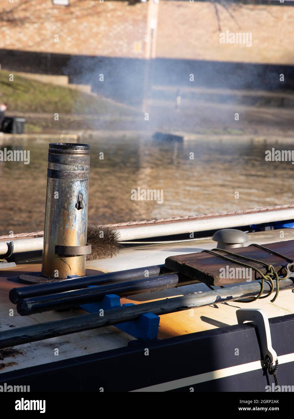 Close up of a smoking chimney on a narrow boat roof Stock Photo