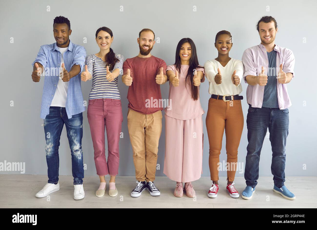 Group of Diverse People Stand Together in home. Stock Photo