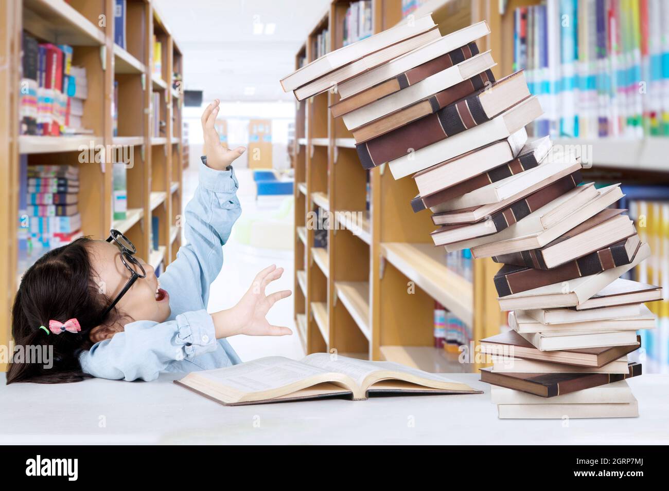 Books falling bookshelf hires stock photography and images Alamy