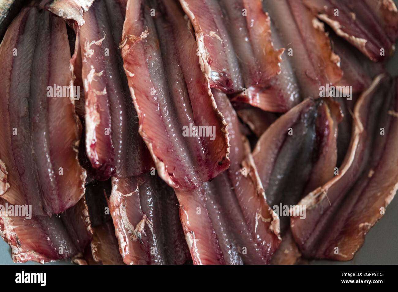 High Angle Close-up Of In Anchovies In Plate Stock Photo